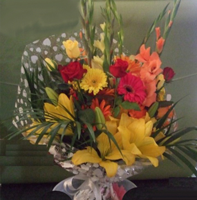 Wrapped Orange red & yellow mix with glaieul, lilies gerberas
