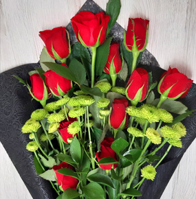 12 red roses in black wrapping