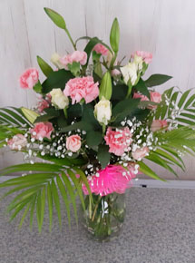 Pink Carnation, White roses & White Lilies in a Vase with a bow tie