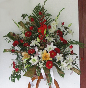 Red Gerberas and Roses with Lillies and glaieul 